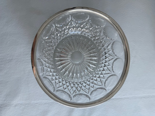 Vintage crystal bowl with silver plated rim.