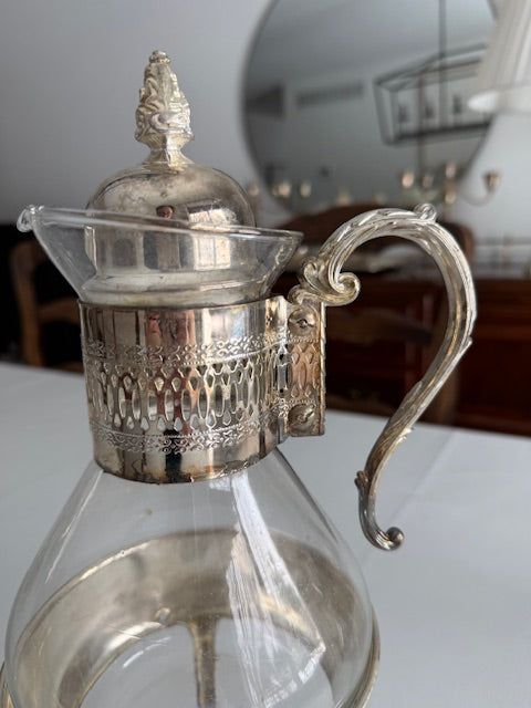 Vintage silver plated glass carafe set.