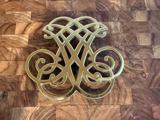 Vintage solid brass trivet.