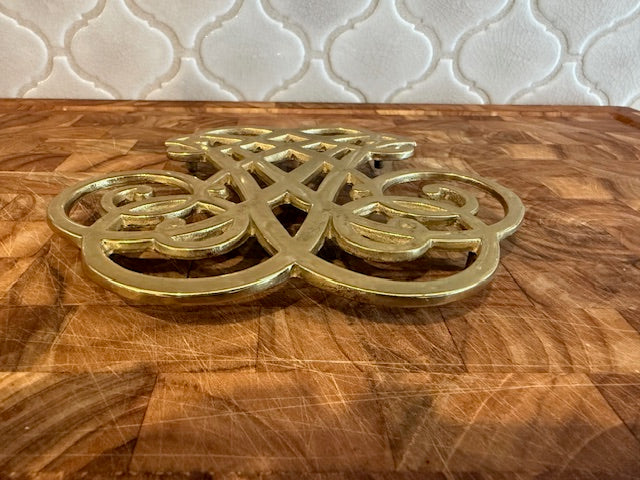 Vintage solid brass trivet.