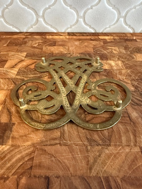 Vintage solid brass trivet.