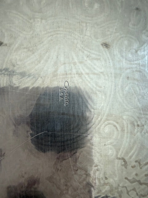 Oneida silver plated oval serving tray with ornate floral engravings.