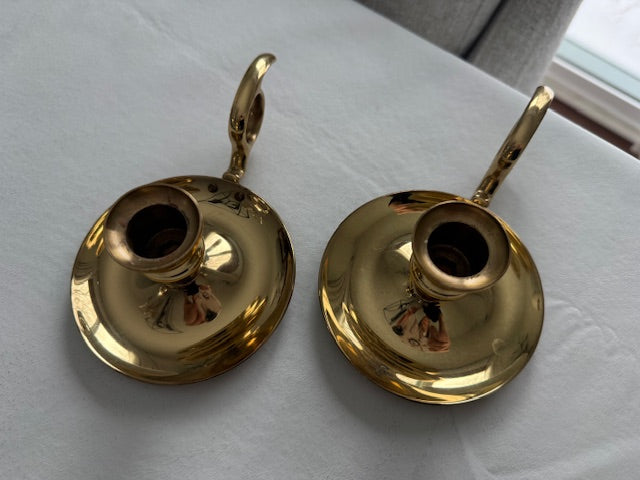 Vintage pair of Baldwin brass chamberstick candle holders designed with a finger loop.