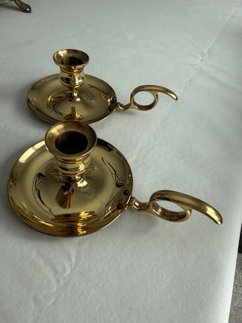 Vintage pair of Baldwin brass chamberstick candle holders designed with a finger loop.