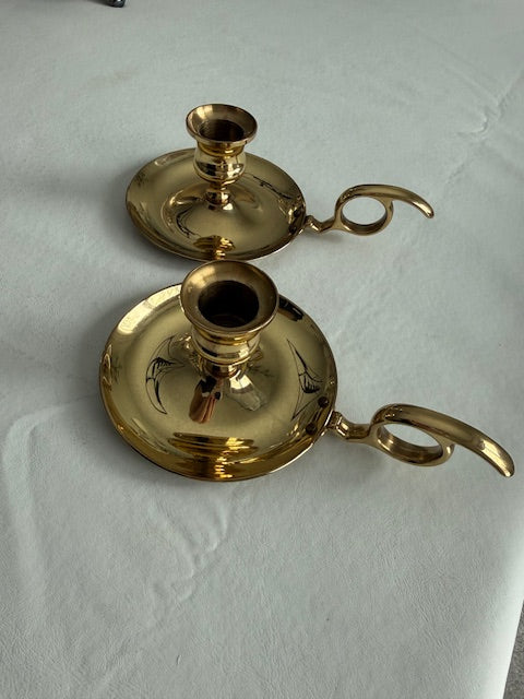 Vintage pair of Baldwin brass chamberstick candle holders designed with a finger loop.