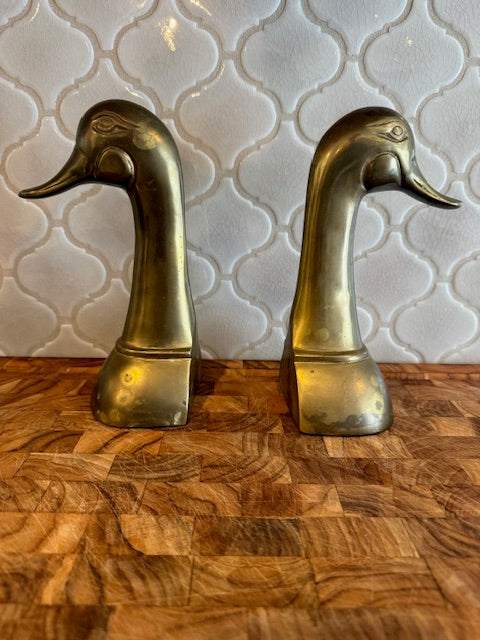 Set of vintage solid brass duck head book ends.
