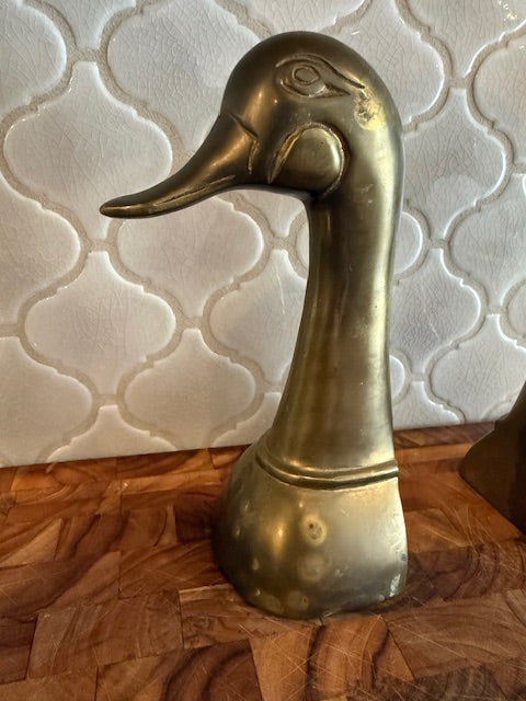 Set of vintage solid brass duck head book ends.