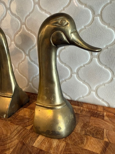 Set of vintage solid brass duck head book ends.