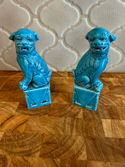 Pair of vintage Chinese glazed ceramic Foo Dog figurines.