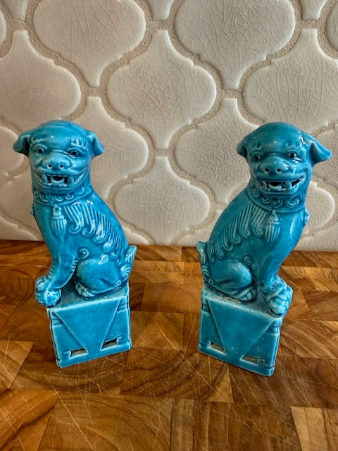 Pair of vintage Chinese glazed ceramic Foo Dog figurines.
