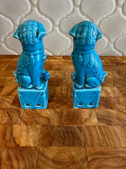 Pair of vintage Chinese glazed ceramic Foo Dog figurines.