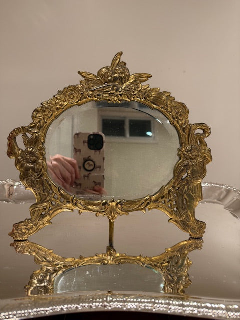 Antique/vintage Cherub mirror with patina.