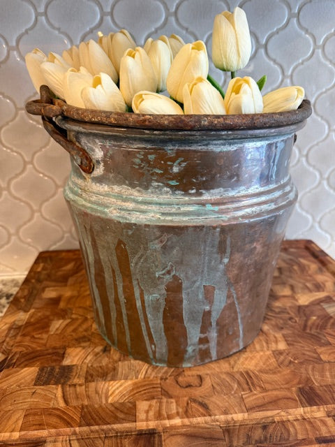 Large copper pot with handle.