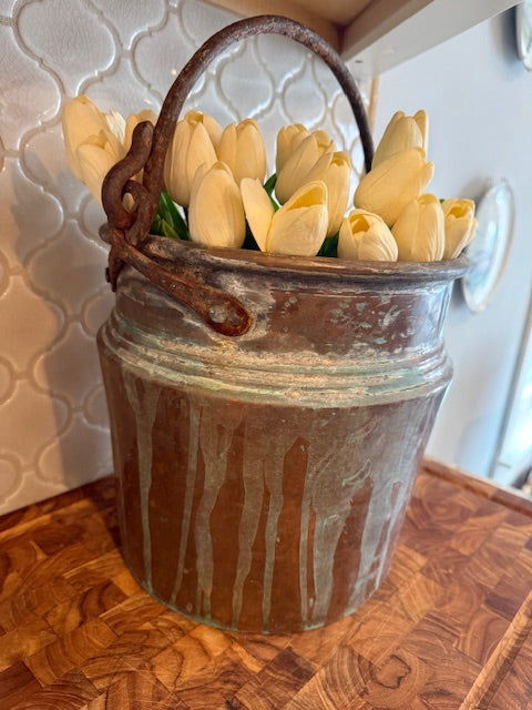 Large copper pot with handle.