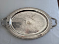 Oneida silver plated oval serving tray with ornate floral engravings.