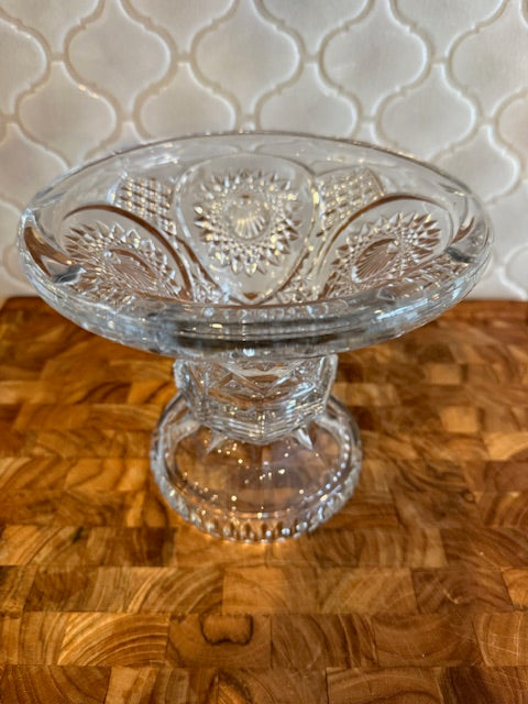 Early American pressed glass punch bowl on a pedestal stand.