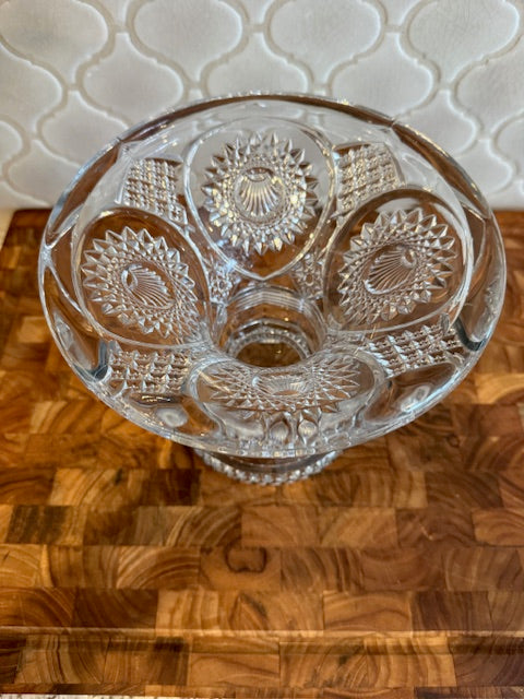 Early American pressed glass punch bowl on a pedestal stand.