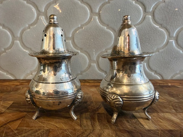 Vintage style salt and pepper shakers silver plated with feet.