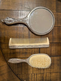Ornate Vanity Set with Comb, Brush, and Mirror.