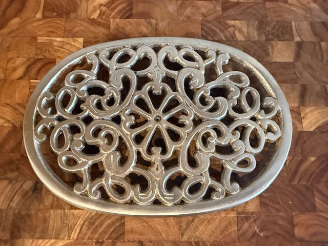 Vintage trivet with hanger.