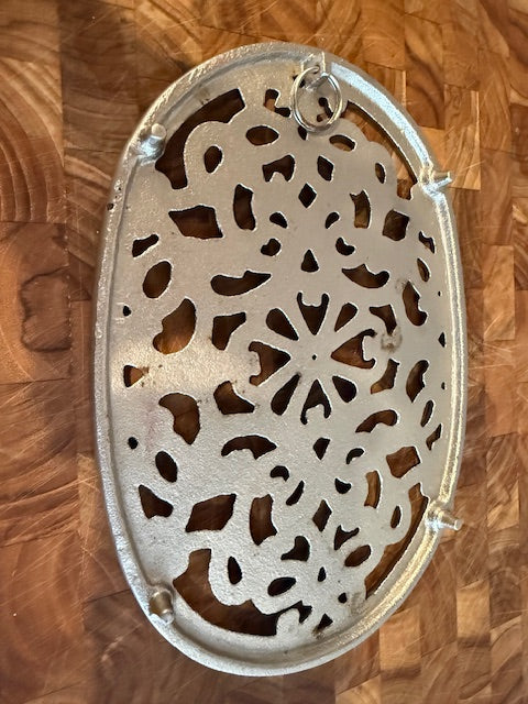 Vintage trivet with hanger.