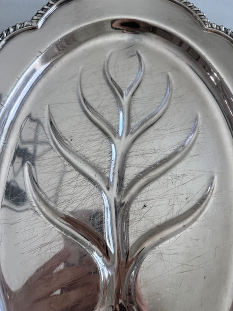 Wallace, vintage engraved silver plated footed oval meat serving platter with well and tree design.