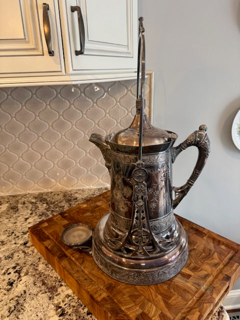 Antique silver plate tilting water pitcher.