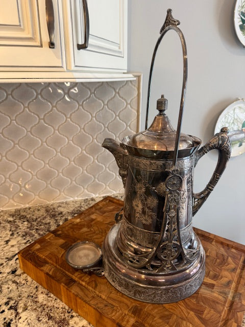Antique silver plate tilting water pitcher.