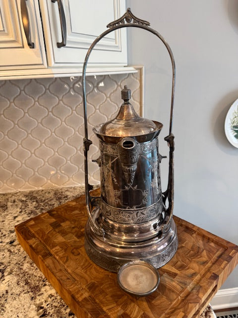 Antique silver plate tilting water pitcher.
