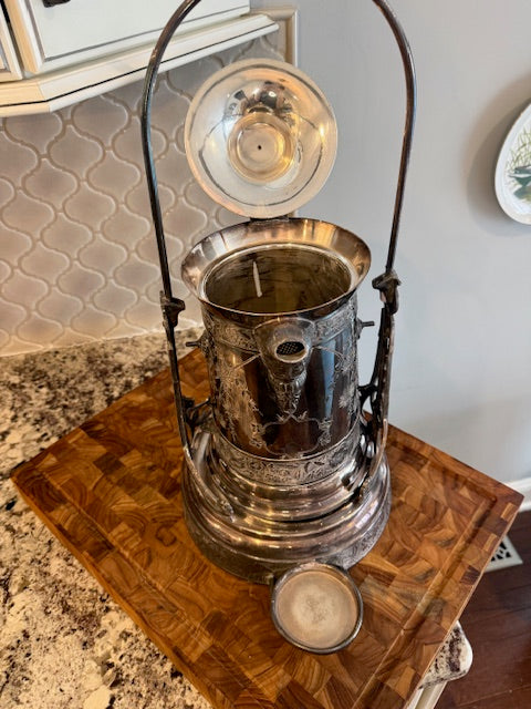 Antique silver plate tilting water pitcher.