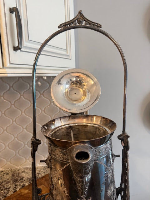 Antique silver plate tilting water pitcher.